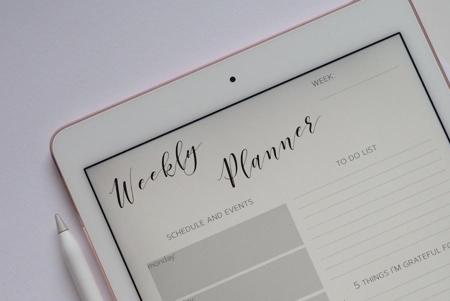 flat lay photography of turned-on silver iPad beside Apple Pencil